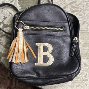 Backpack purse with a B